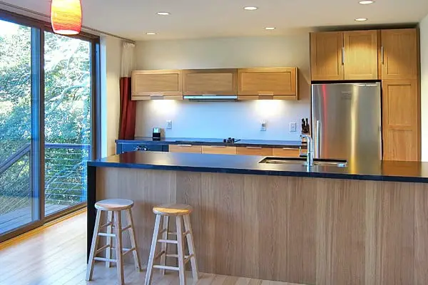 Alchemy Architects Customized WeeHouse Prefab Home Williamsburg With View Of Kitchen Bar And Cabinets.