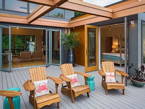 Blu Home Breezehouse prefab home big deck with chairs.