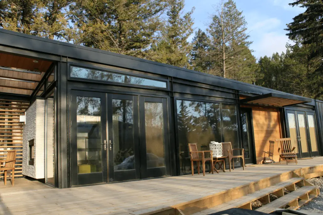 The Bow prefab home - view of deck and rear french doors.