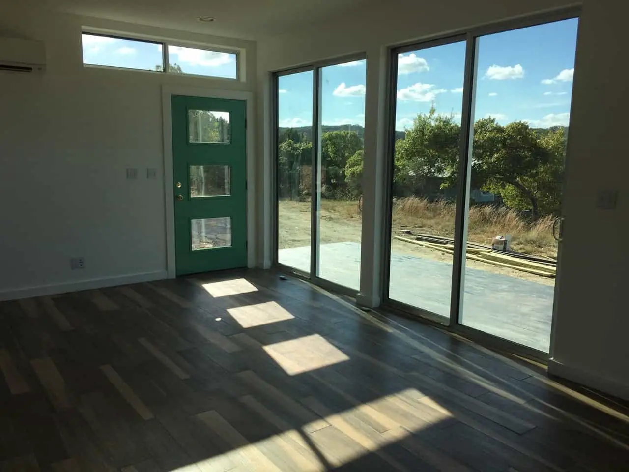MA Modular Grand-Ma prefab home interior living area and sliding glass doors to rear deck.