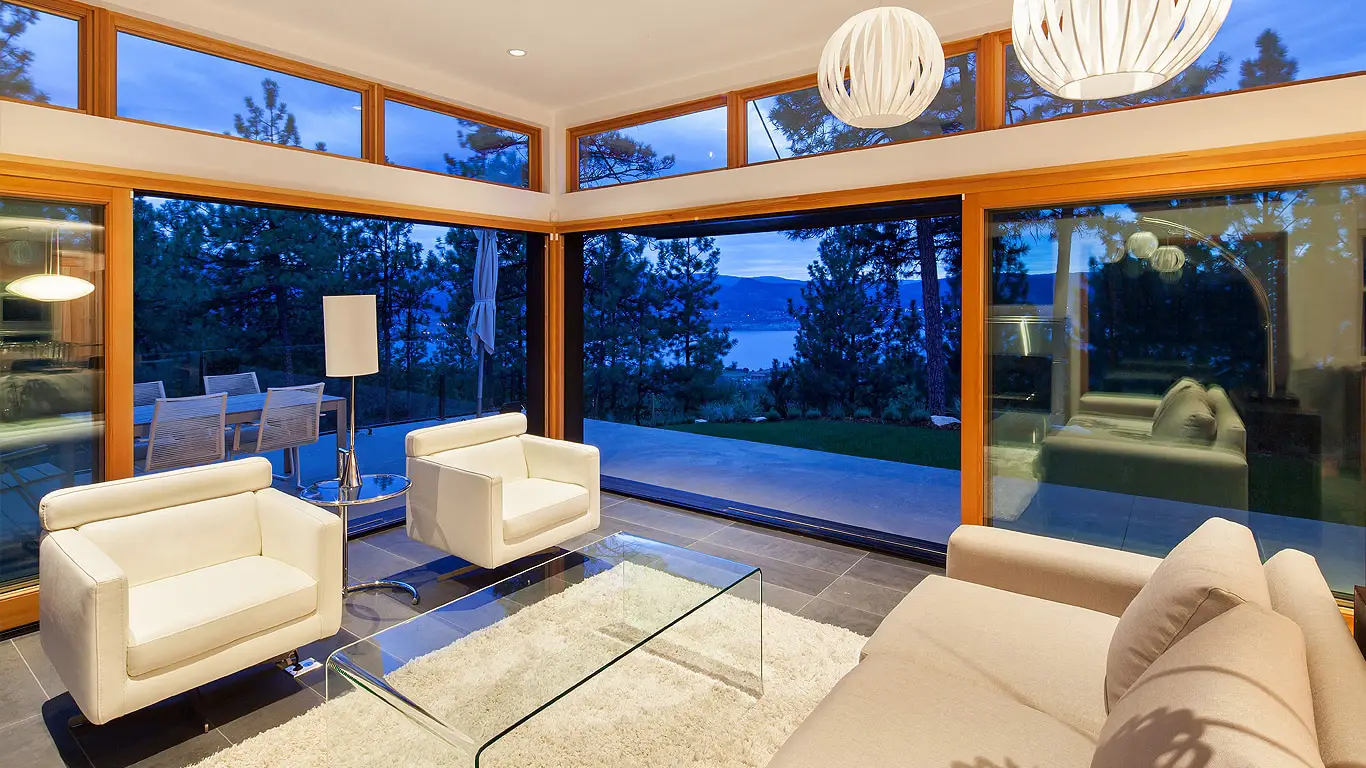 Dvele modern prefab living room with large and celestial windows.